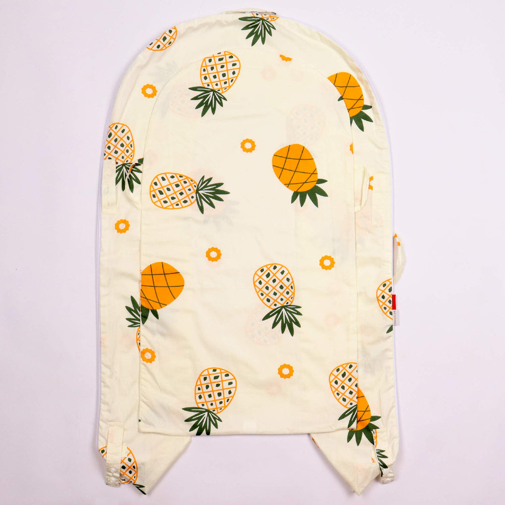 DockATot pineapple-pattern cover safely replaces old covers while maintaining breathability.