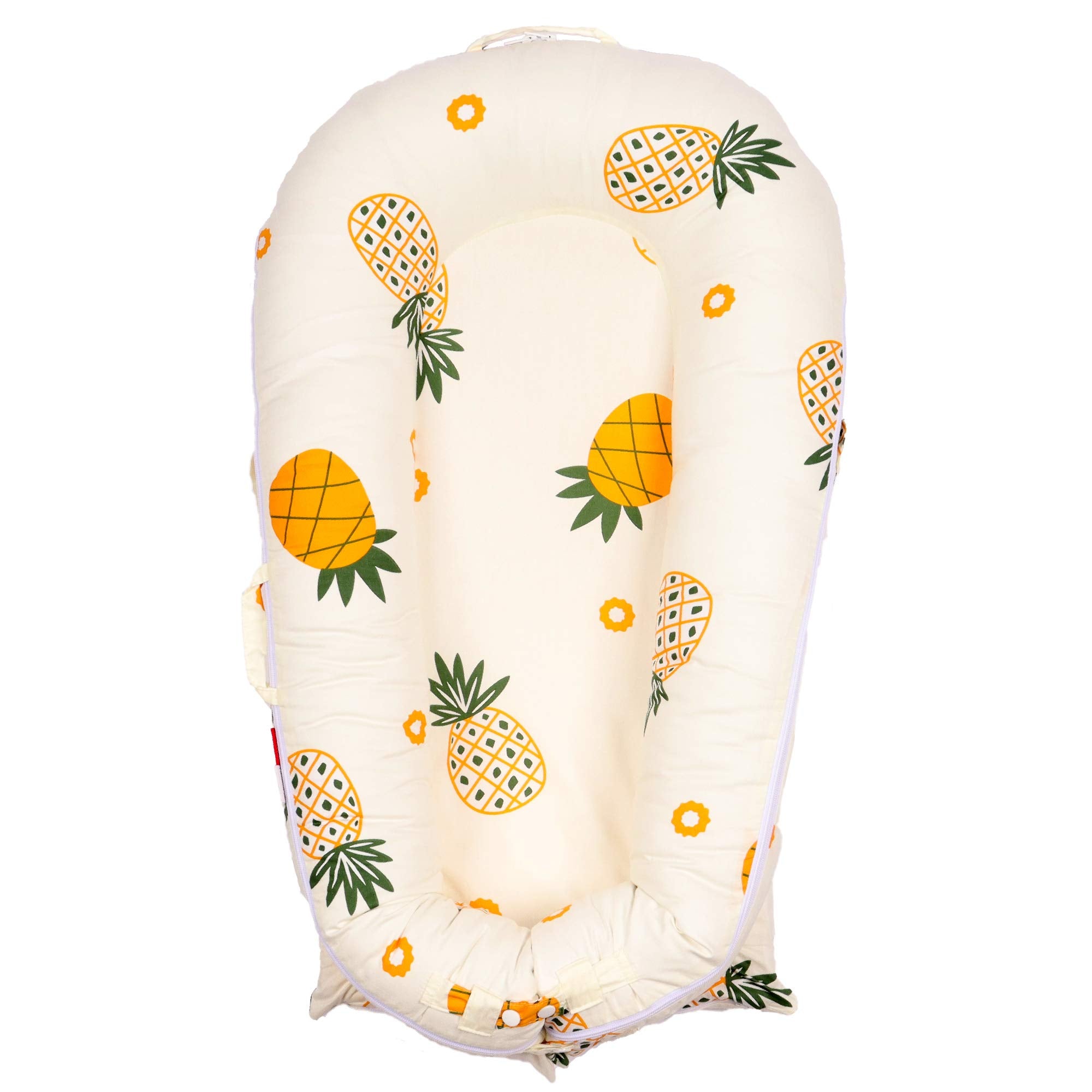 DockATot Deluxe Lounger Cover in pineapples print offers breathable, hypoallergenic protection.