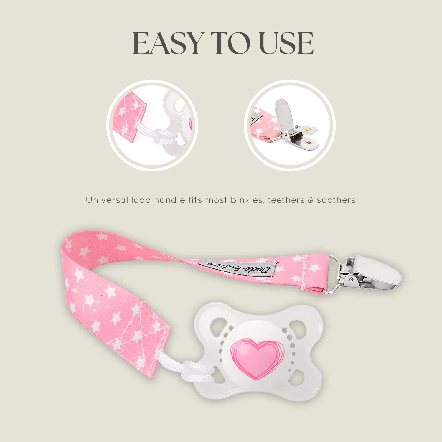 Dodo Babies metal clip attaches softly to bibs without snagging fabric.