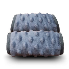 DODO NICI car-seat strap cover with cozy padding protects baby's face and shoulders.