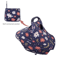 Dodo Nici eye contact window flap keeps baby engaged while protected.