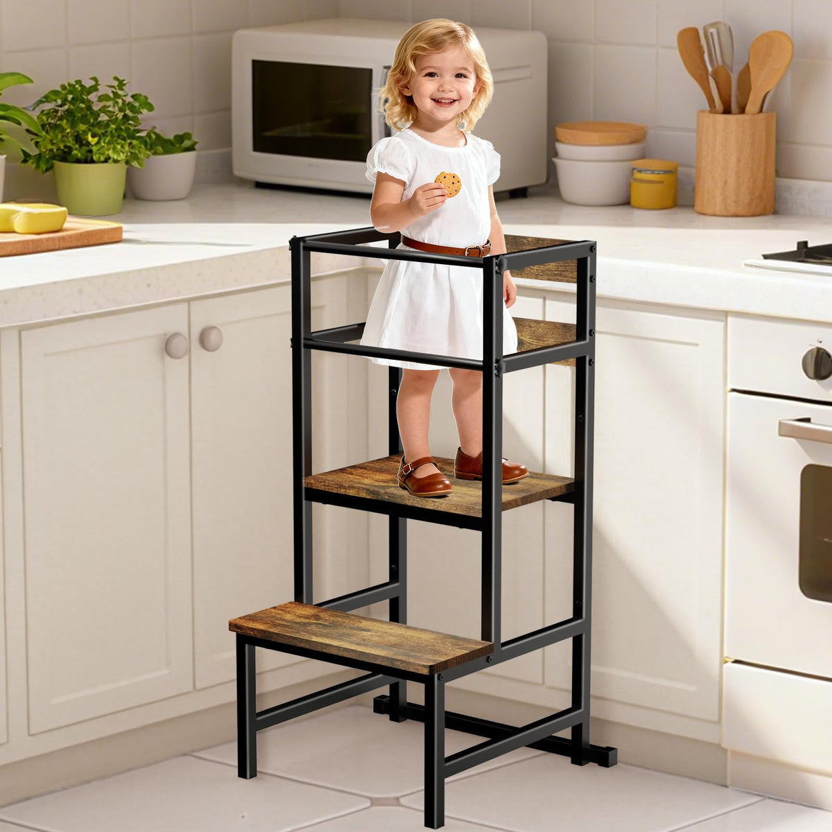Doerpuz toddler tower with safety rail offers secure reach for independent tasks.