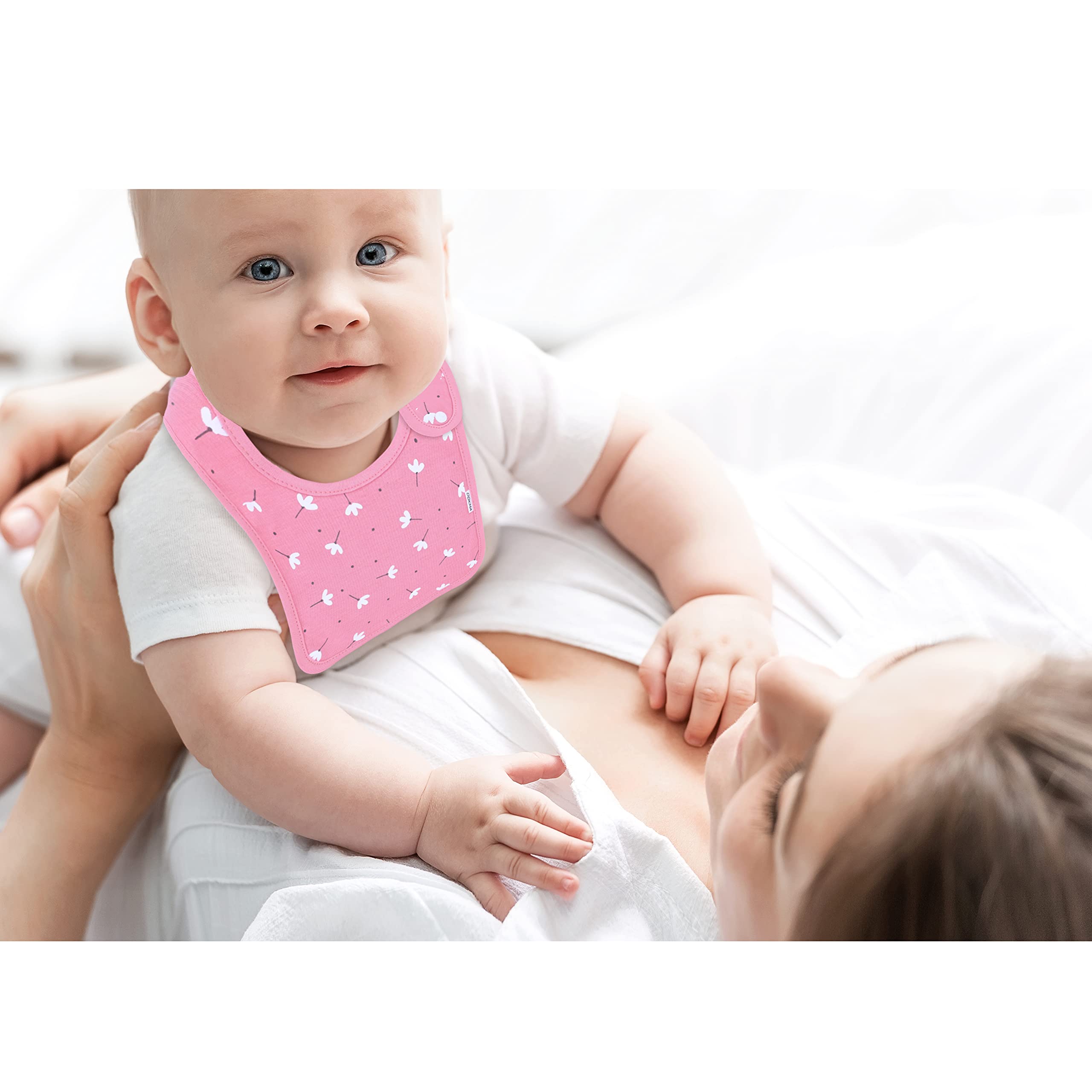 DOKMA bibs feature 100% organic cotton front layer for gentle skin contact.