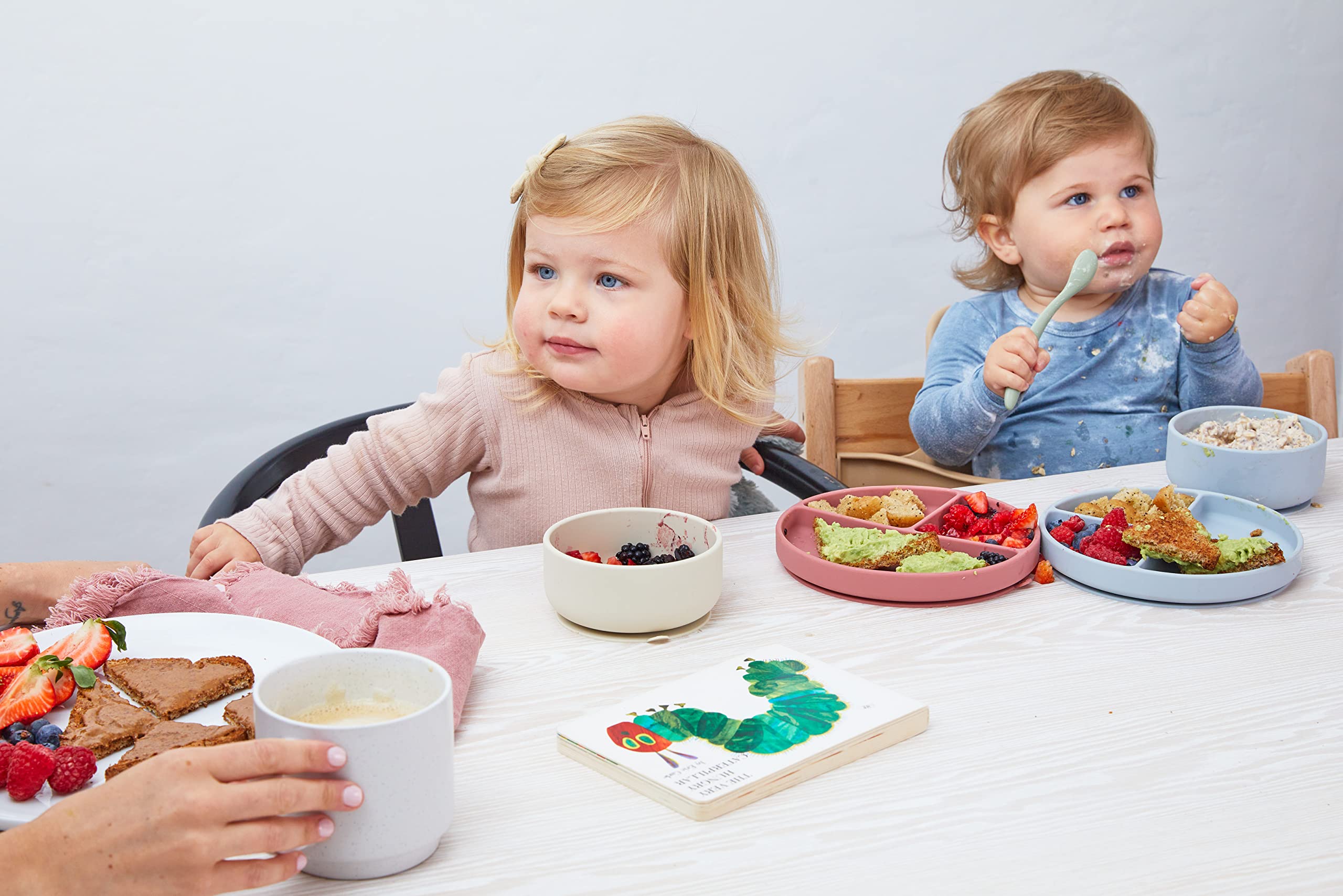 Dollop plate during mealtime emphasizes mess minimization and easy-grip handling.