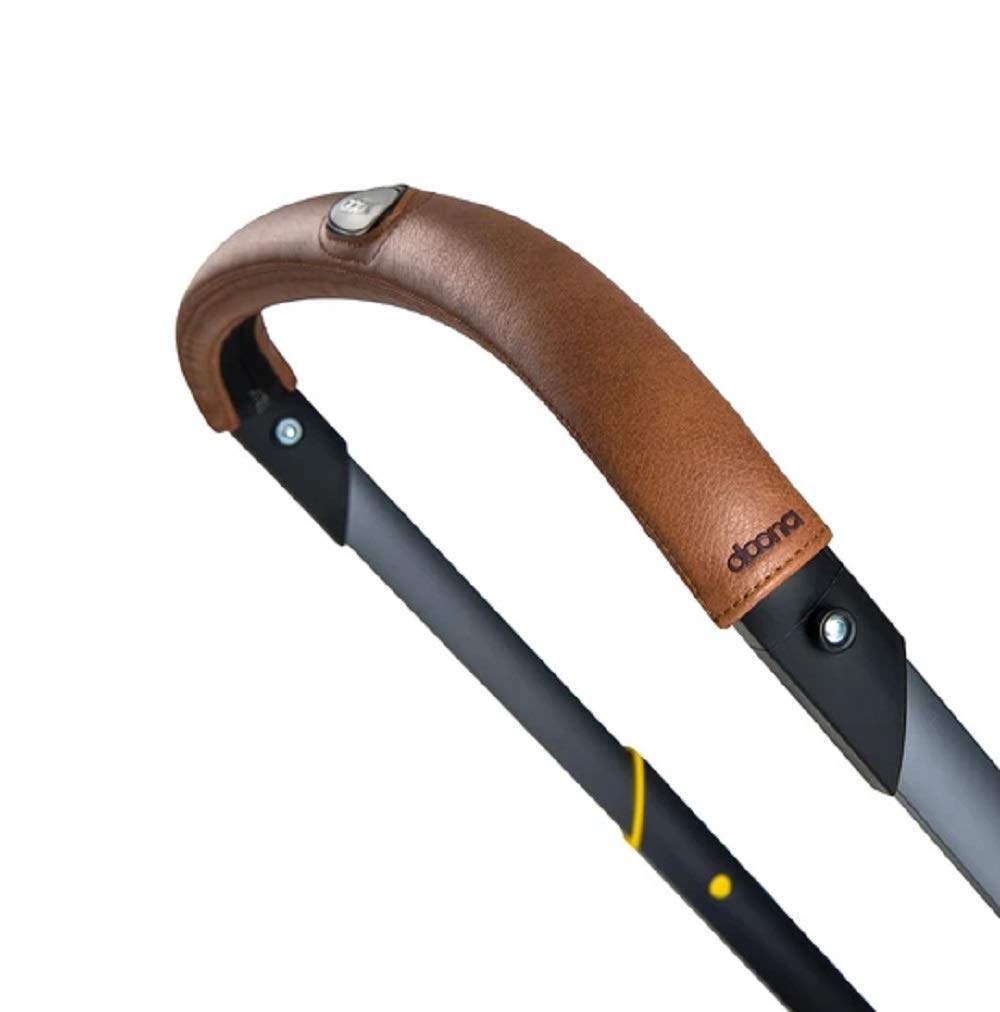 Doona handlebar cover in brown enhances grip and style on a stroller.