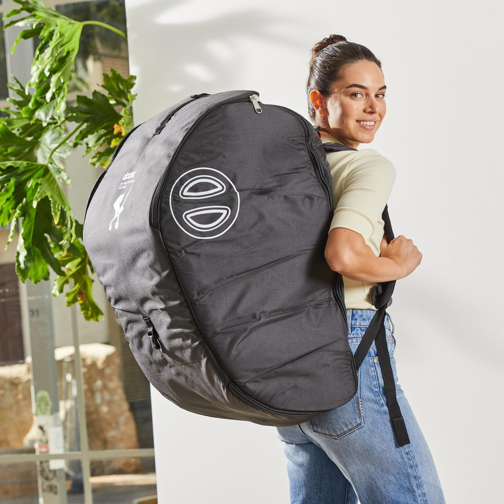 DOONA travel bag folded for compact storage, ready for travel.