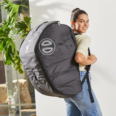 DOONA travel bag folded for compact storage, ready for travel.