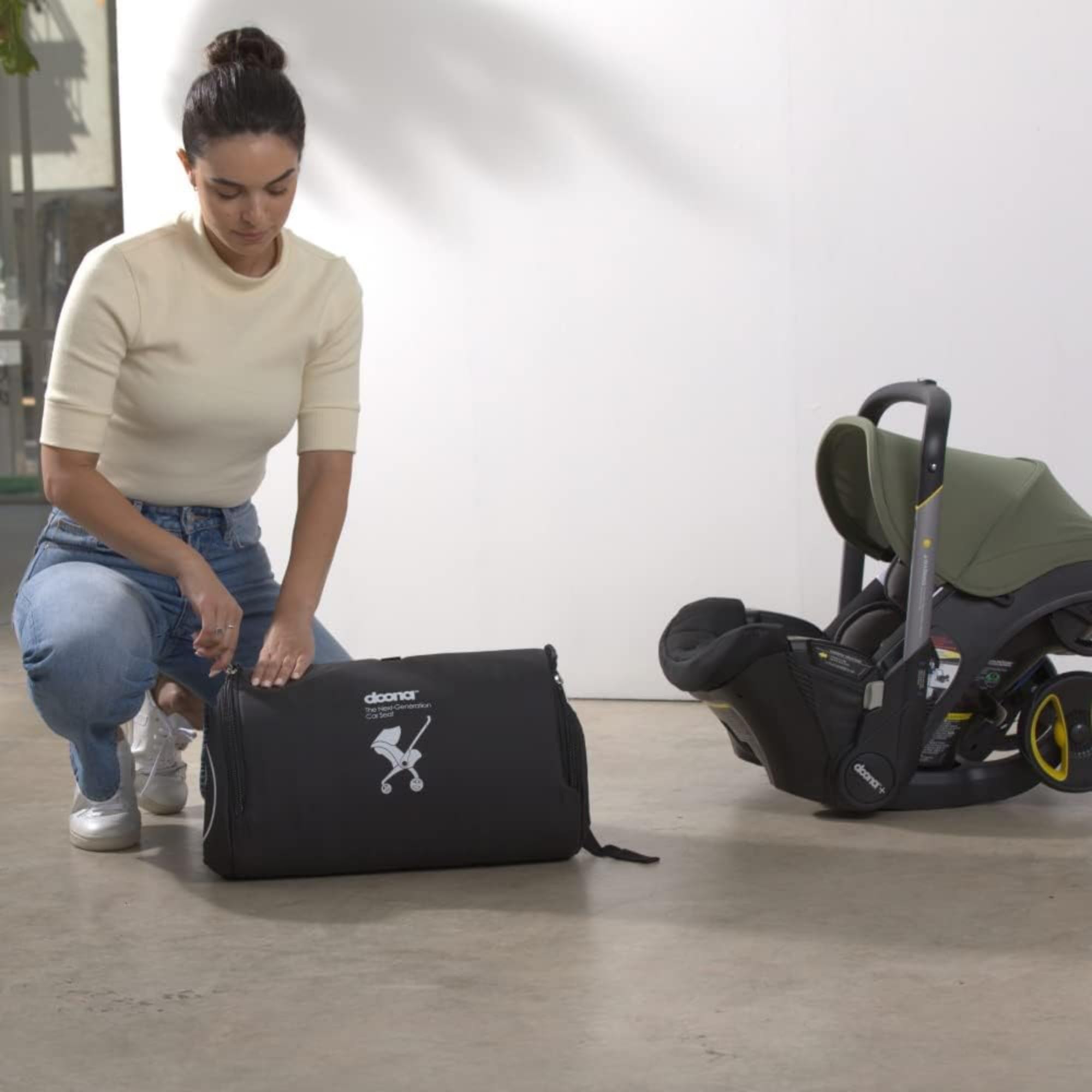 DOONA travel bag in use, protecting Doona on air, sea, and land.