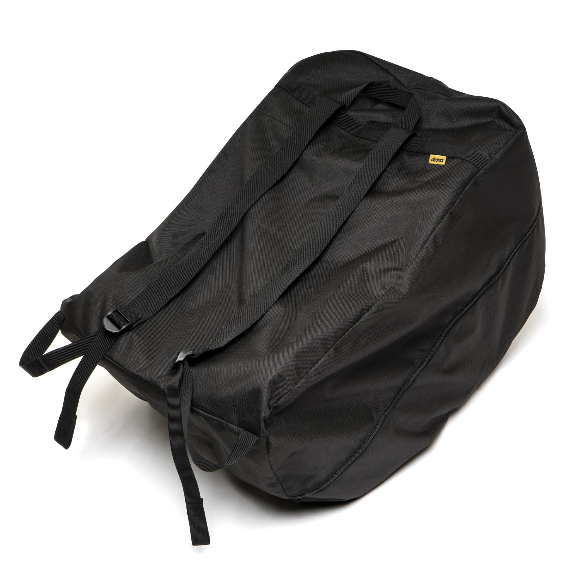DOONA Travel Bag black folded into its pouch for compact storage and easy travel.