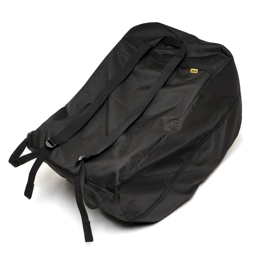 DOONA Travel Bag black folded into its pouch for compact storage and easy travel.