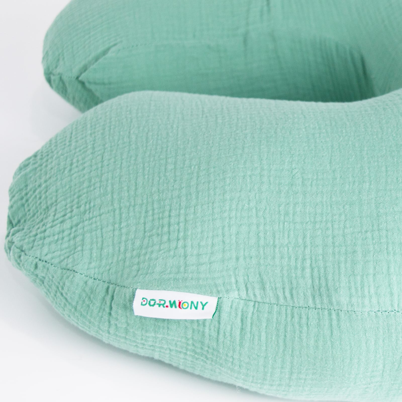 Dormlony nursing pillow supporting sitting and tummy time during play sessions.