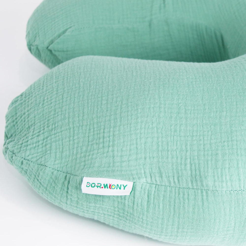 Dormlony nursing pillow supporting sitting and tummy time during play sessions.