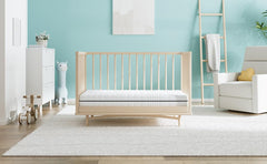 Dourxi infant-side firm foam provides stable support during naps.