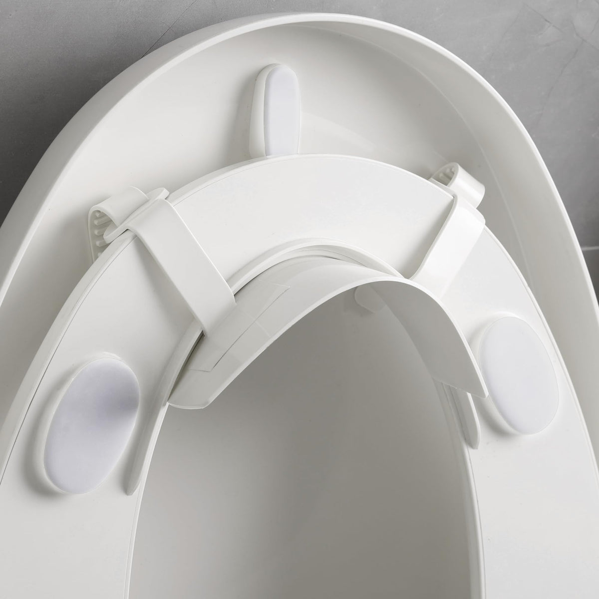 Doytn universal pee deflector on a toilet seat preventing splash and mess.