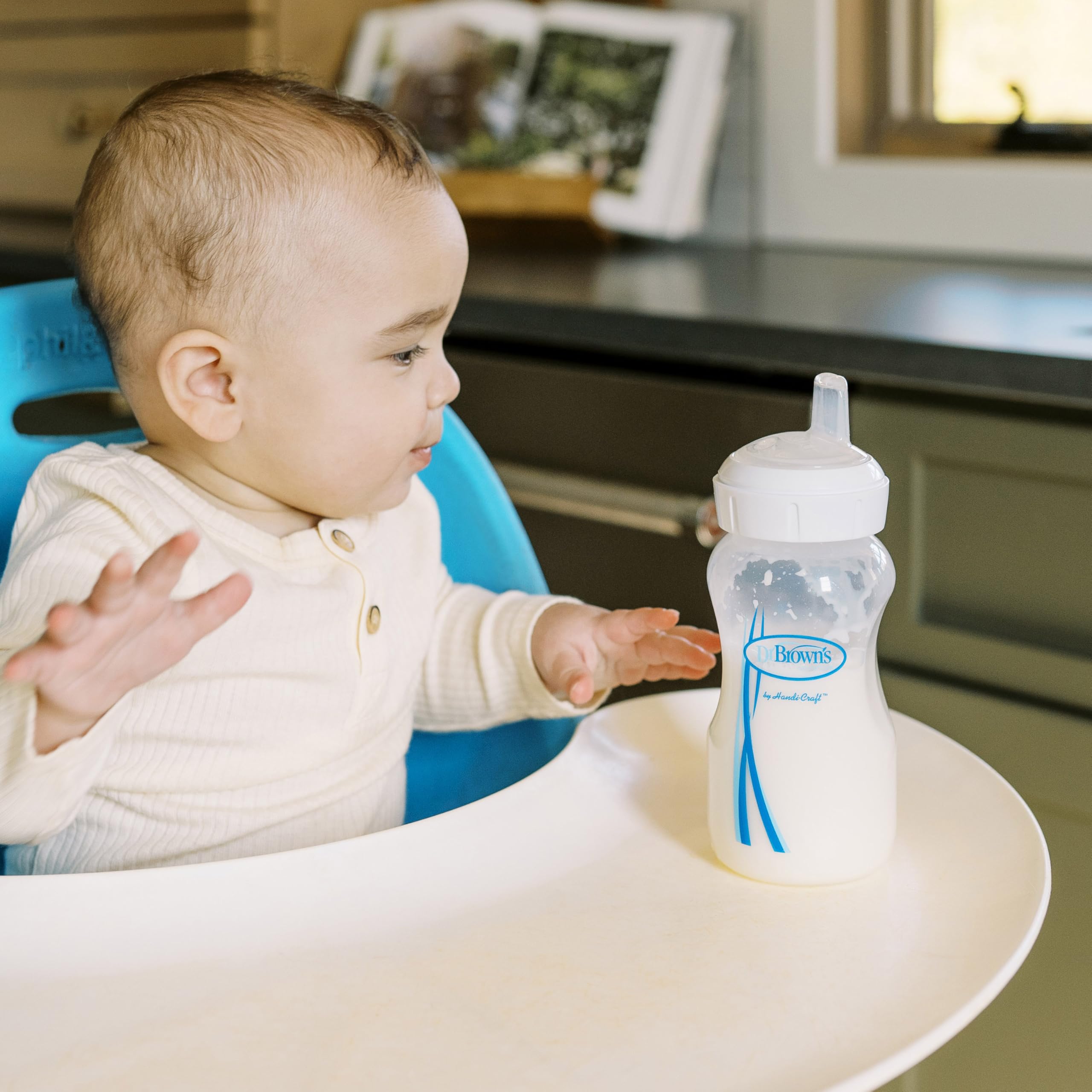 Vent removal step to switch to sippy spout on Dr. Brown's bottle