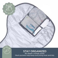 Dreambaby Fold and Go with mesh pockets for organizing diapers and wipes.