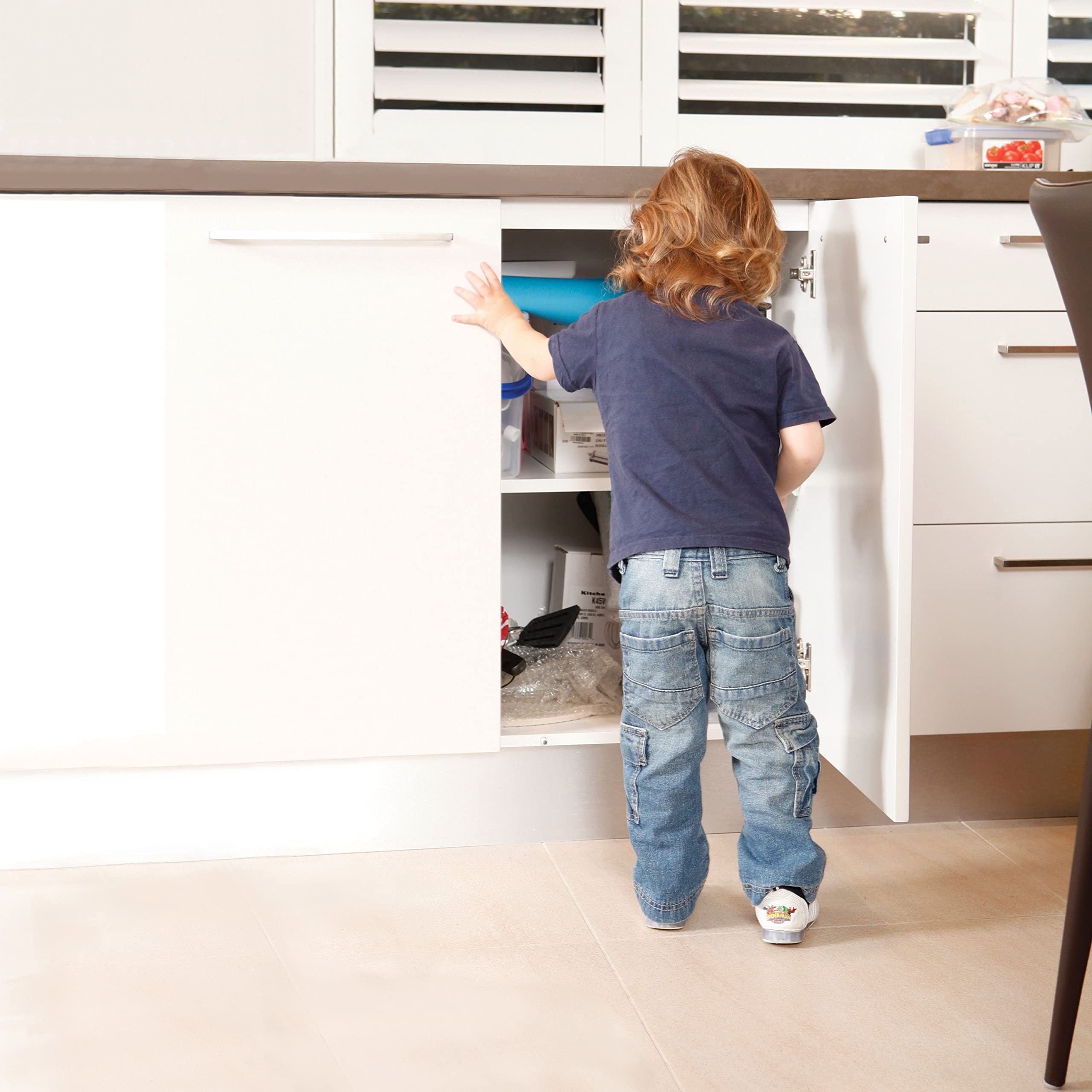 Dreambaby sliding locks being slid closed to demonstrate easy operation.
