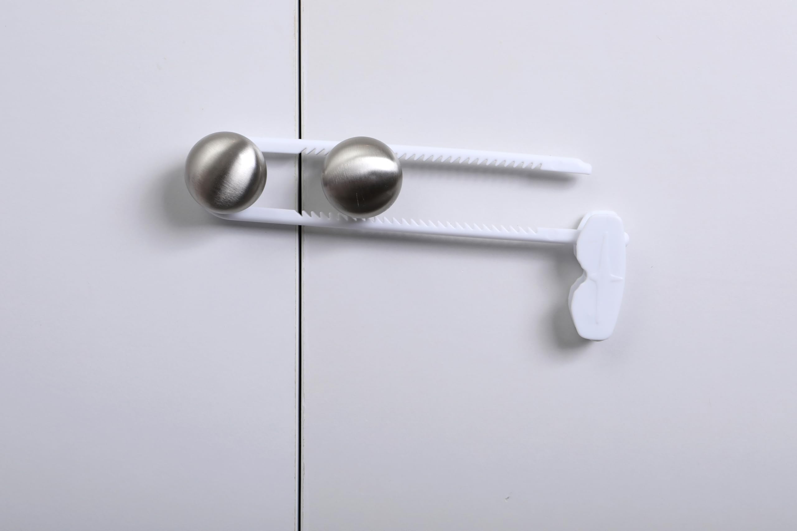 Dreambaby sliding locks on side-by-side fridge doors for easy access control