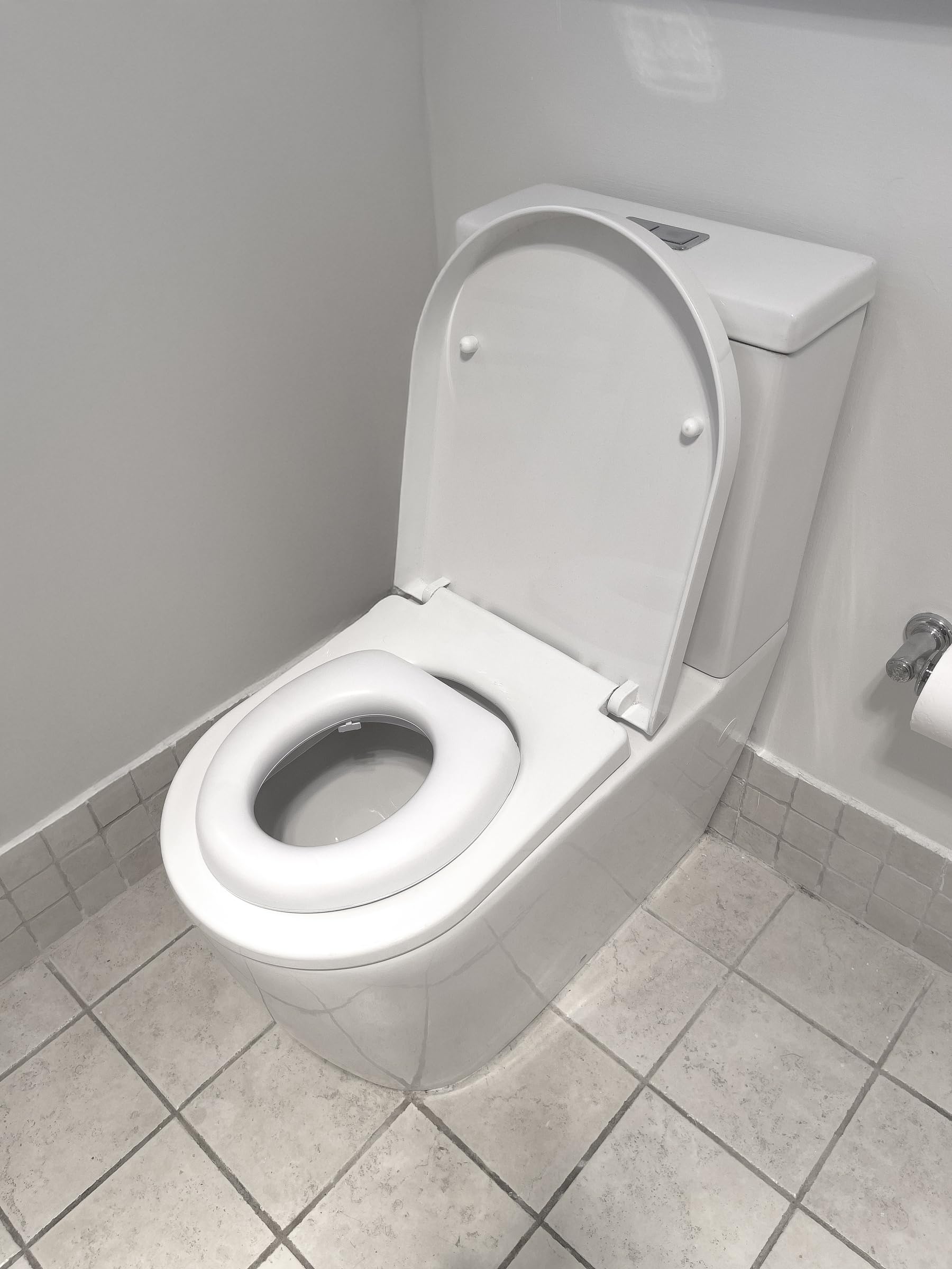 Dreambaby Soft Touch Potty Seat on a standard toilet showing universal fit
