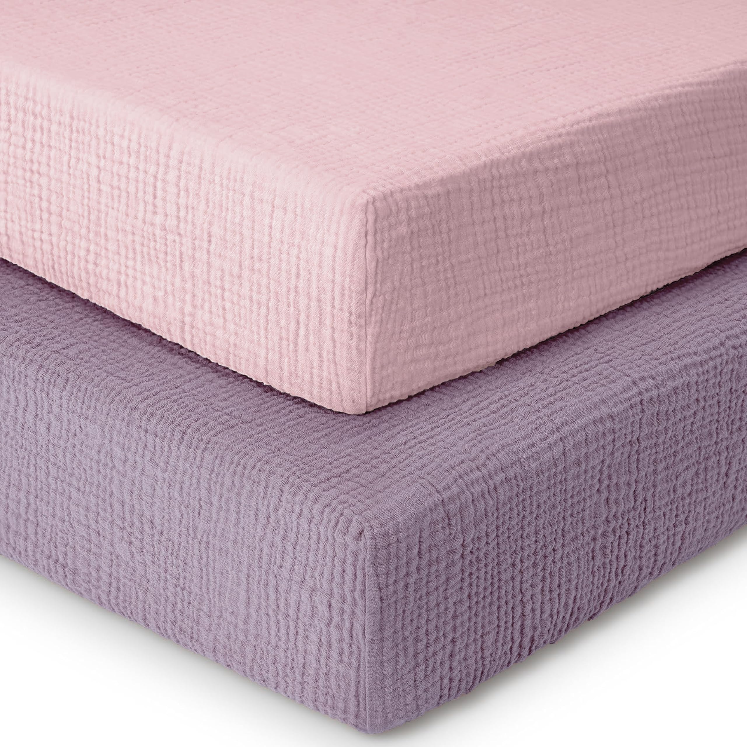 Dreamology muslin crib sheet 2-pack on a standard crib mattress, showing a snug fit.