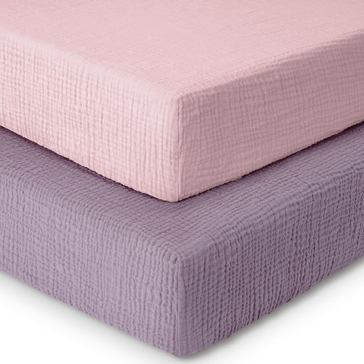 Dreamology muslin crib sheet 2-pack on a standard crib mattress, showing a snug fit.