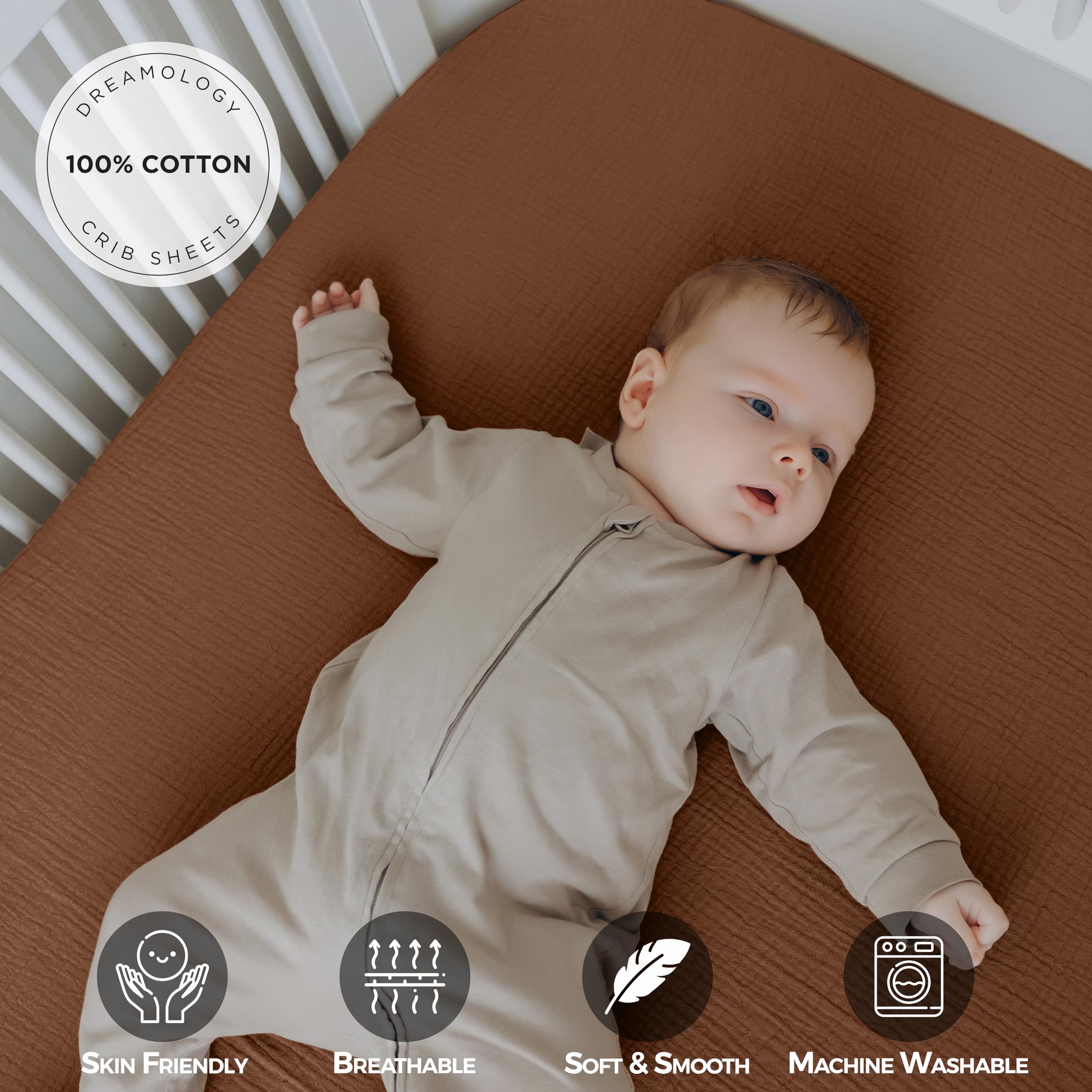 Dreamology muslin crib sheet close-up shows elastic edge for secure fit.