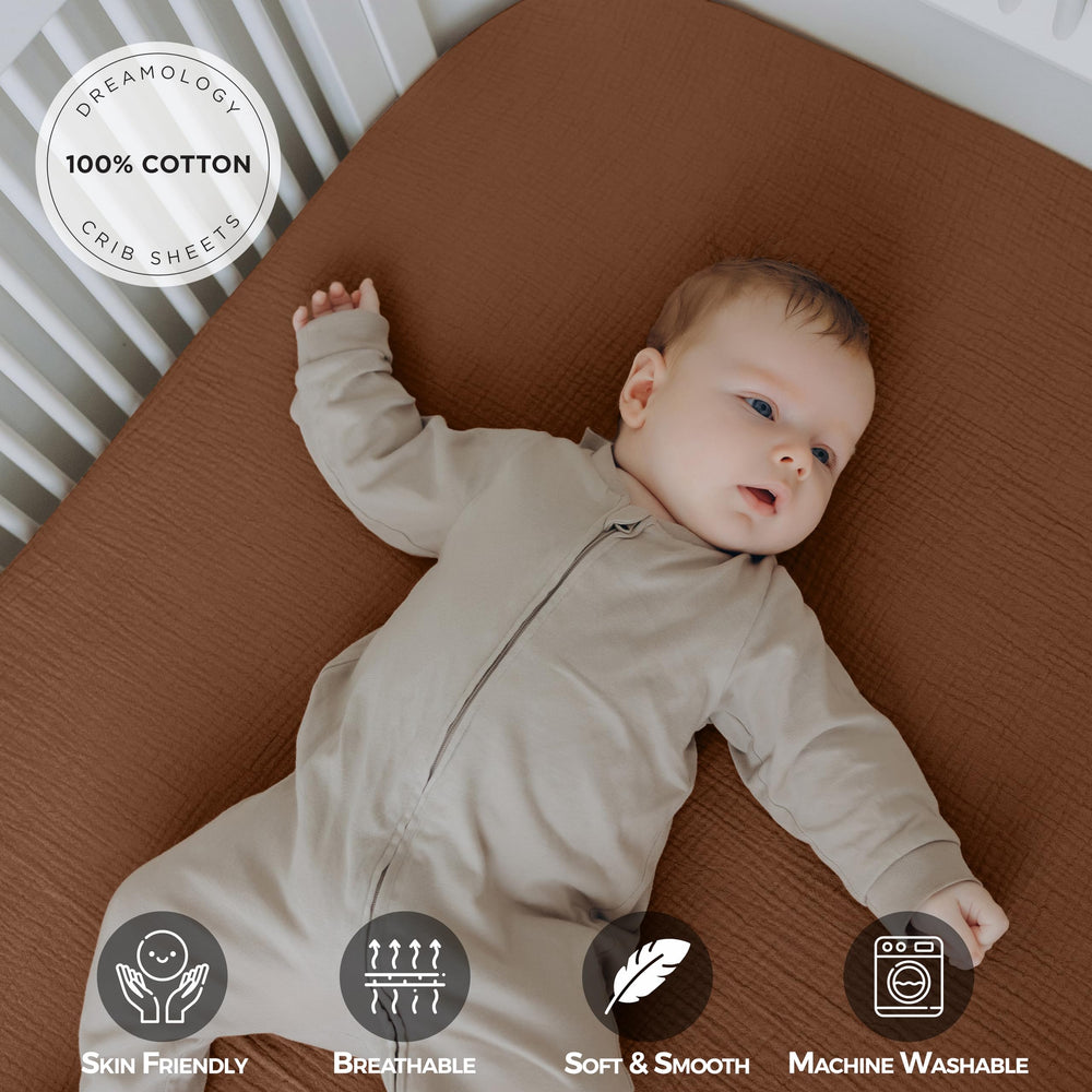 Dreamology muslin crib sheet close-up shows elastic edge for secure fit.