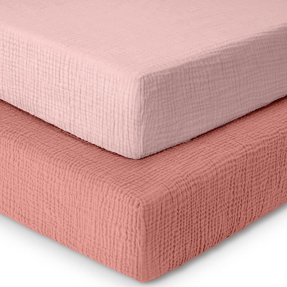 Dreamology muslin crib sheets 2-pack pink, soft fabric for standard cribs.