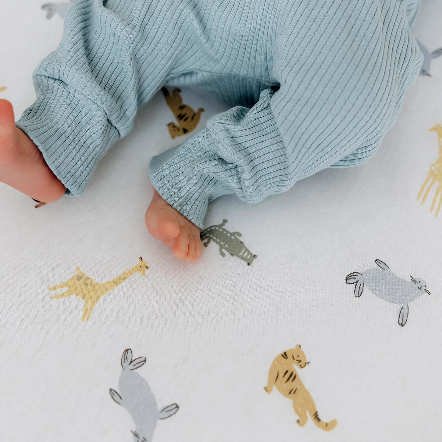 Dreamology sky blue crib sheet demonstrates machine-washable care for lasting softness.
