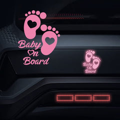 Dreothy footprint baby on board sign on back window boosts driver awareness.
