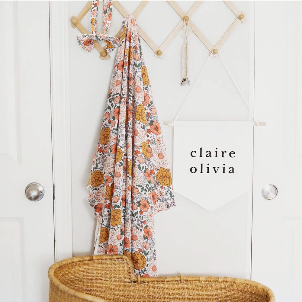 Blanket folded neatly; DRESHOW BQUBO floral design on display