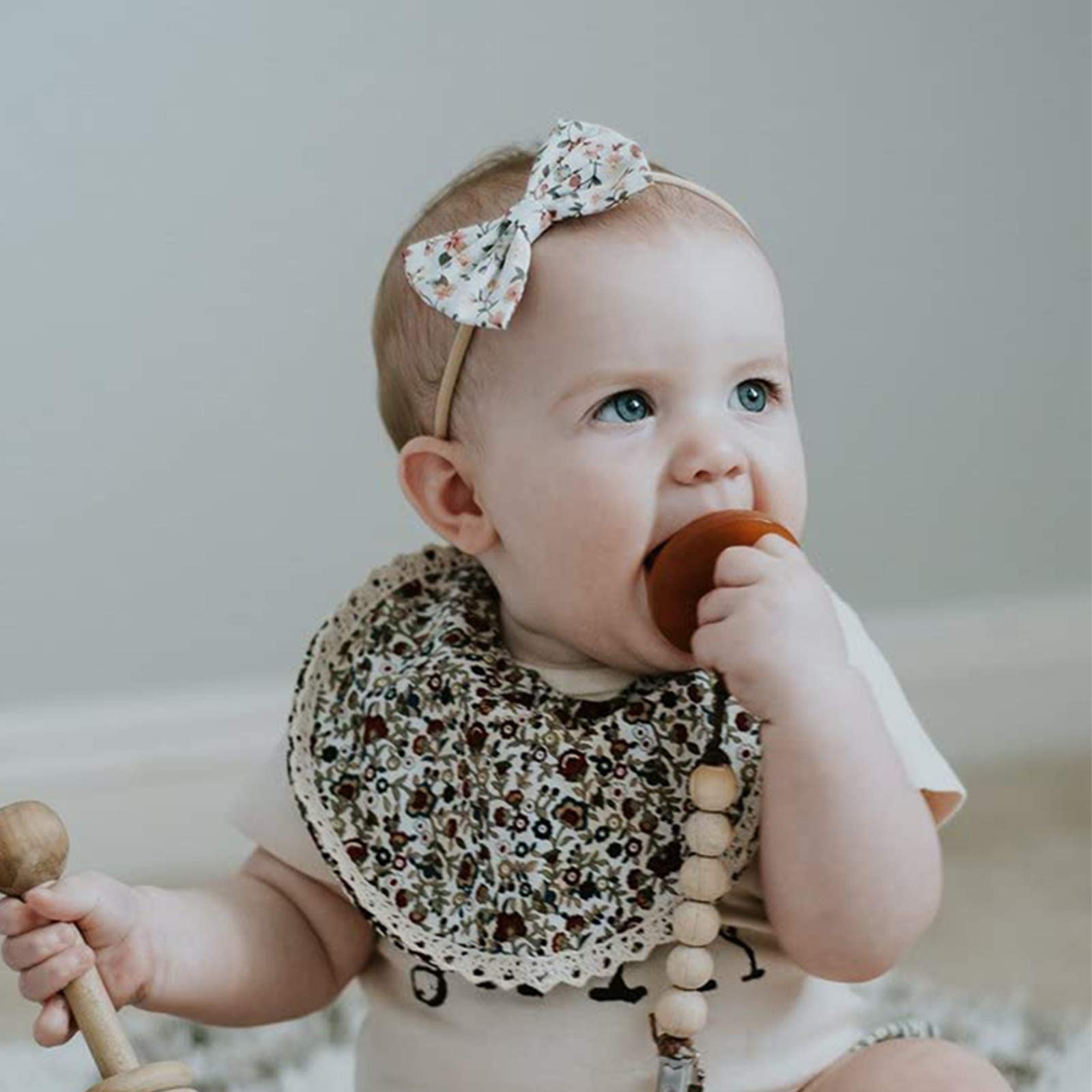 DRESHOW BQUBO handmade fabric bow detail enhances baby styling with delicate craftsmanship.