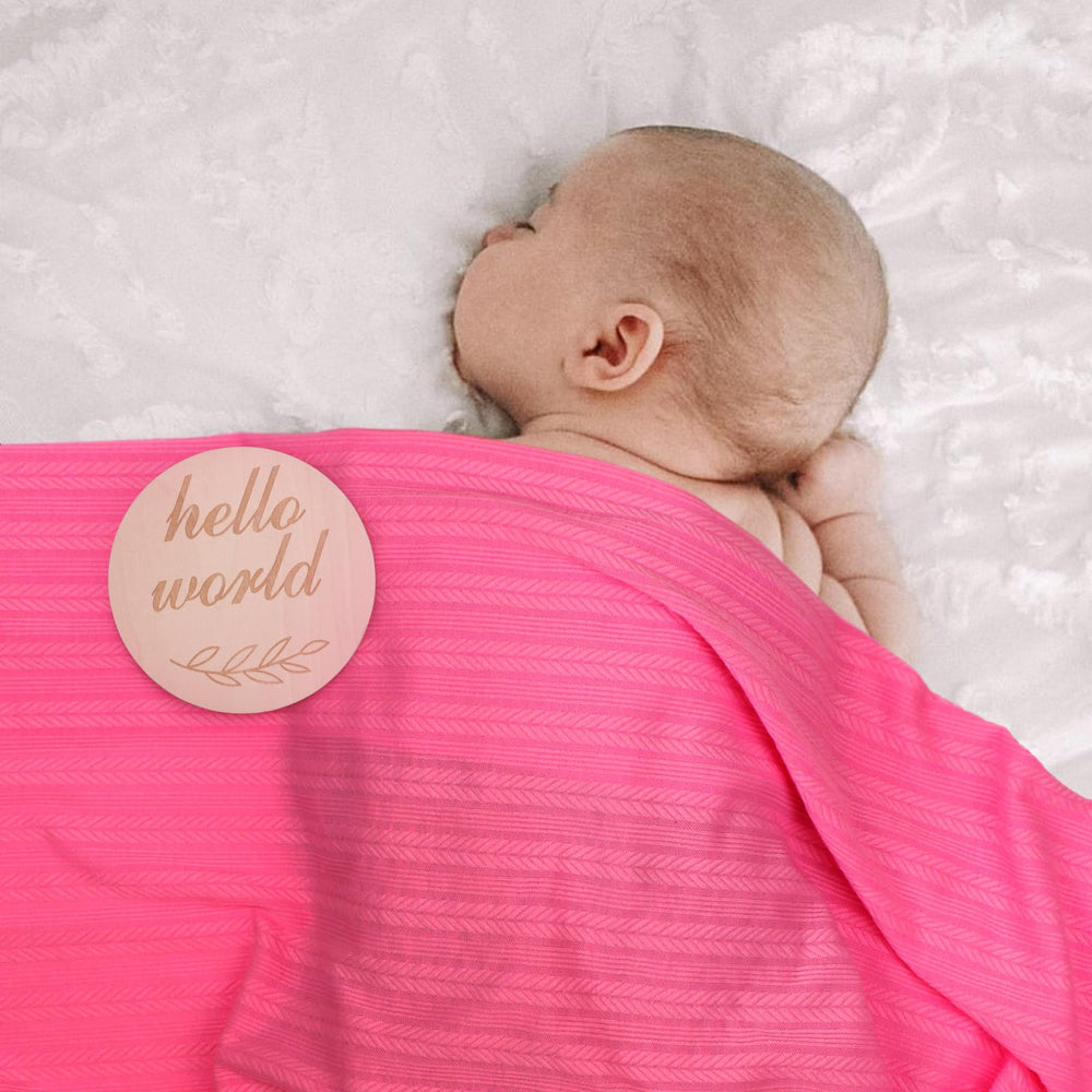 Multi-use blanket shown as nursing cover, sun shade, or stroller cover
