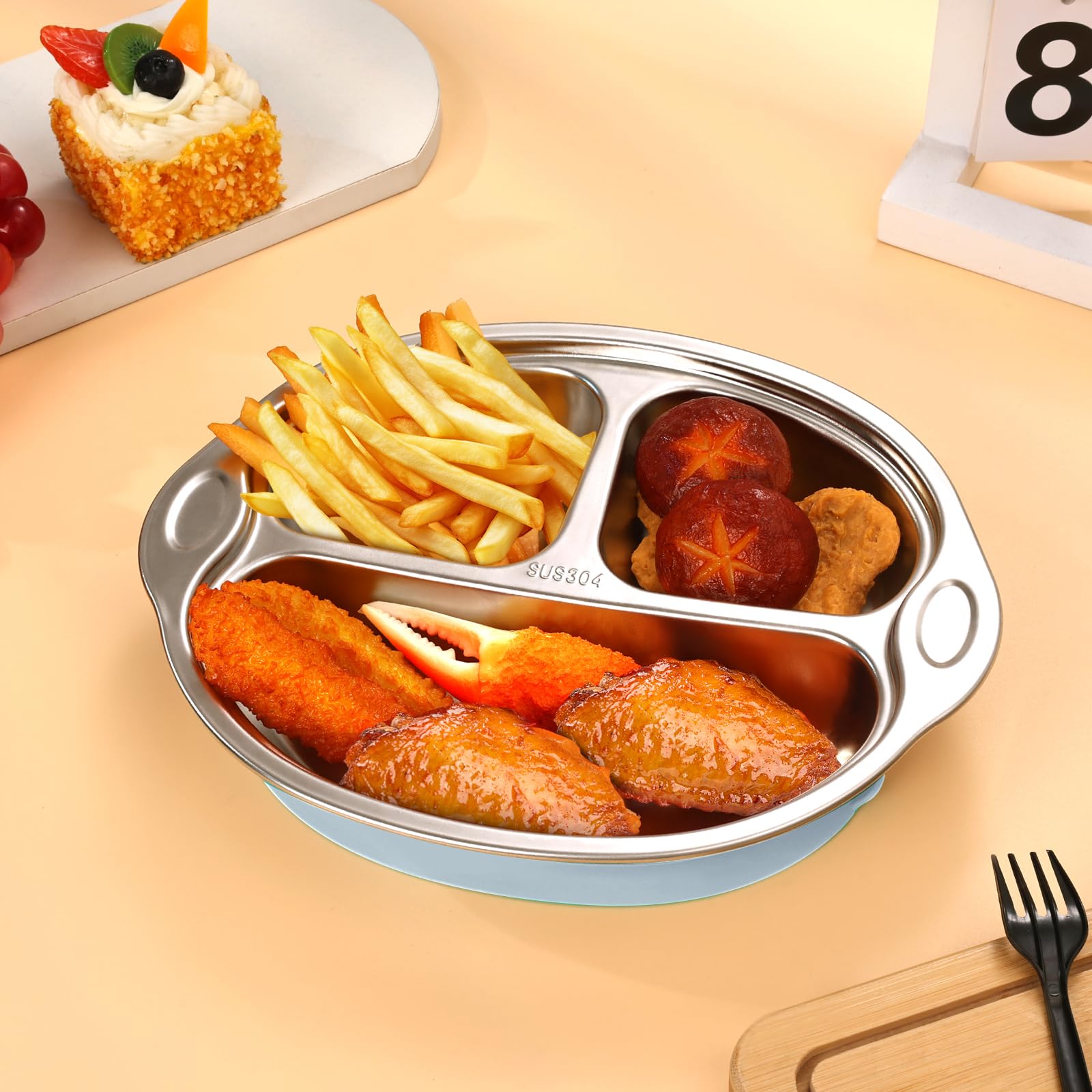 Dualshine blue plate displayed with fruit and food for mealtime usage.