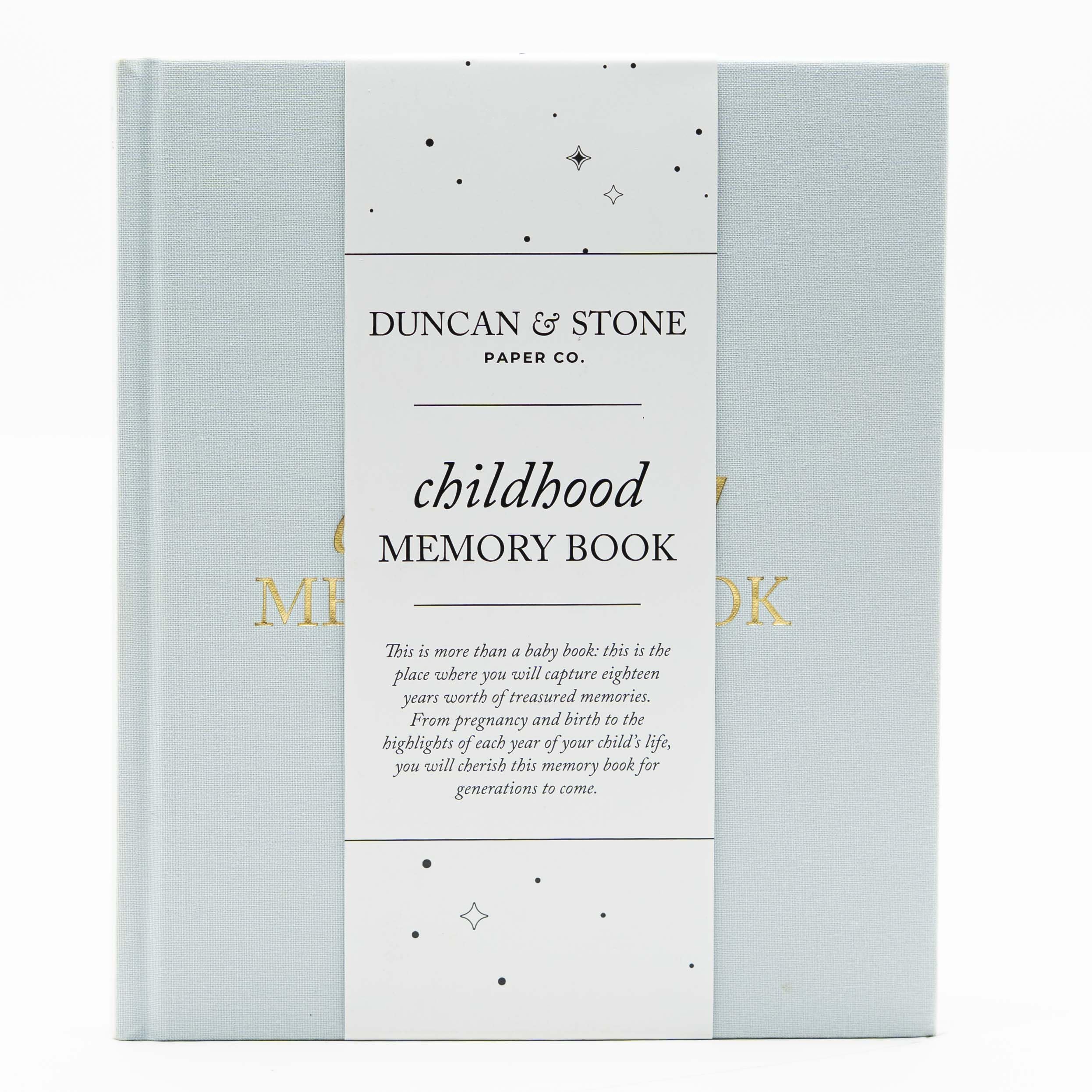 Duncan & Stone Childhood Memory Book cover in sky blue linen with gold embossing.