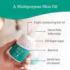 Earth Mama Calendula Baby Oil on hands for gentle newborn massage.