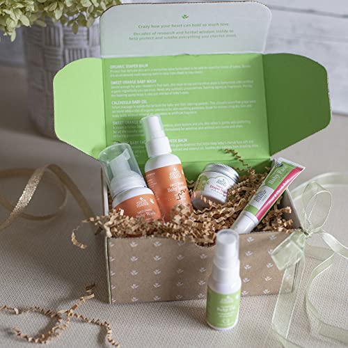 Newborn care items neatly arranged for a bath routine
