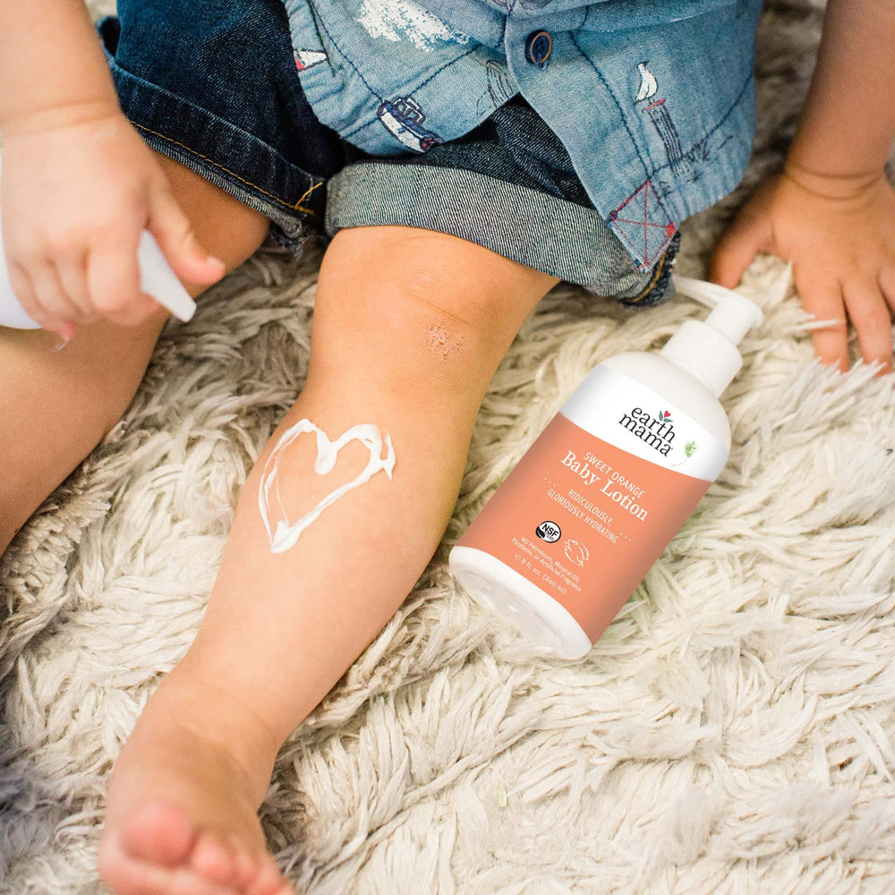Newborn-safe Earth Mama Sweet Orange Baby Lotion for gentle care.