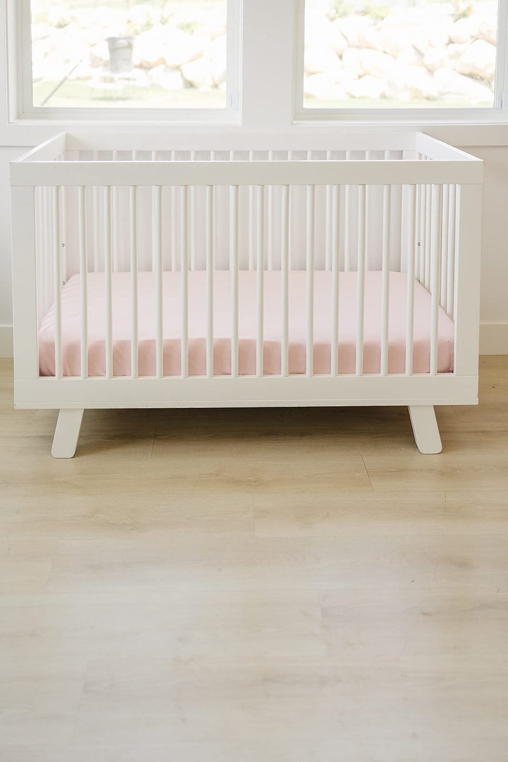 Ecolino fitted crib sheet shows elastic hem for a secure, snug fit.