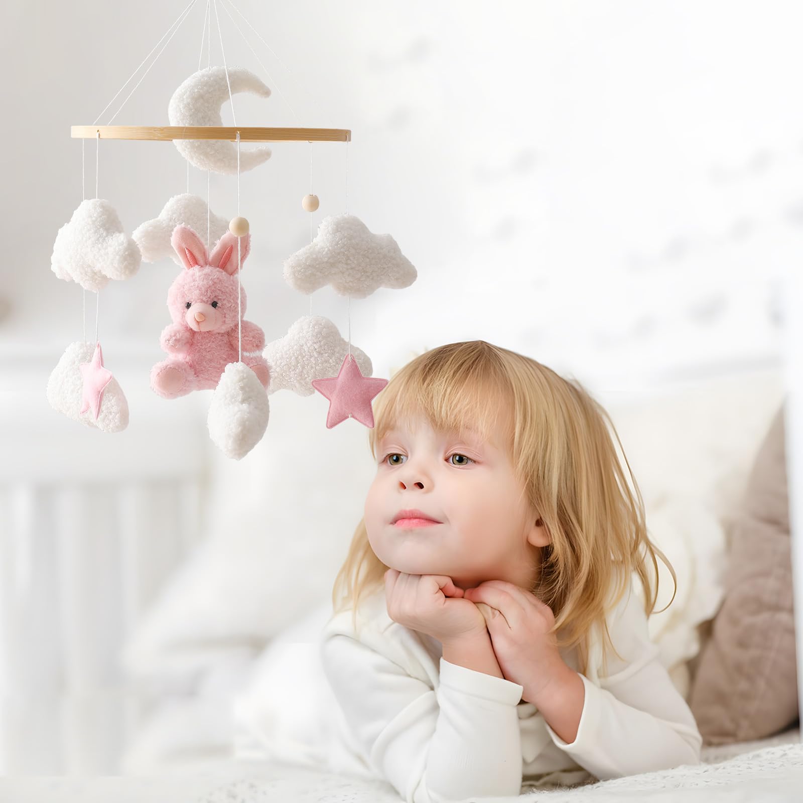 EERKEOD pink bunny mobile used as a photo prop for newborn moments