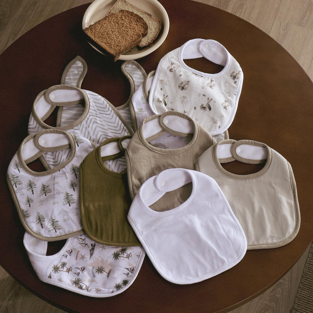 Egmao Baby bibs shown during use, catching drool during teething sessions.