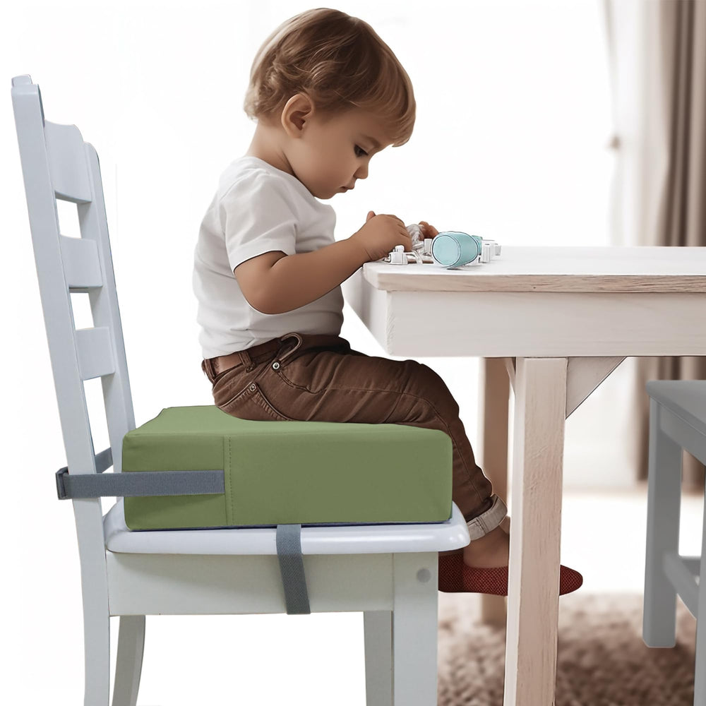 Eiury booster seat green easy-clean surface resists spills.