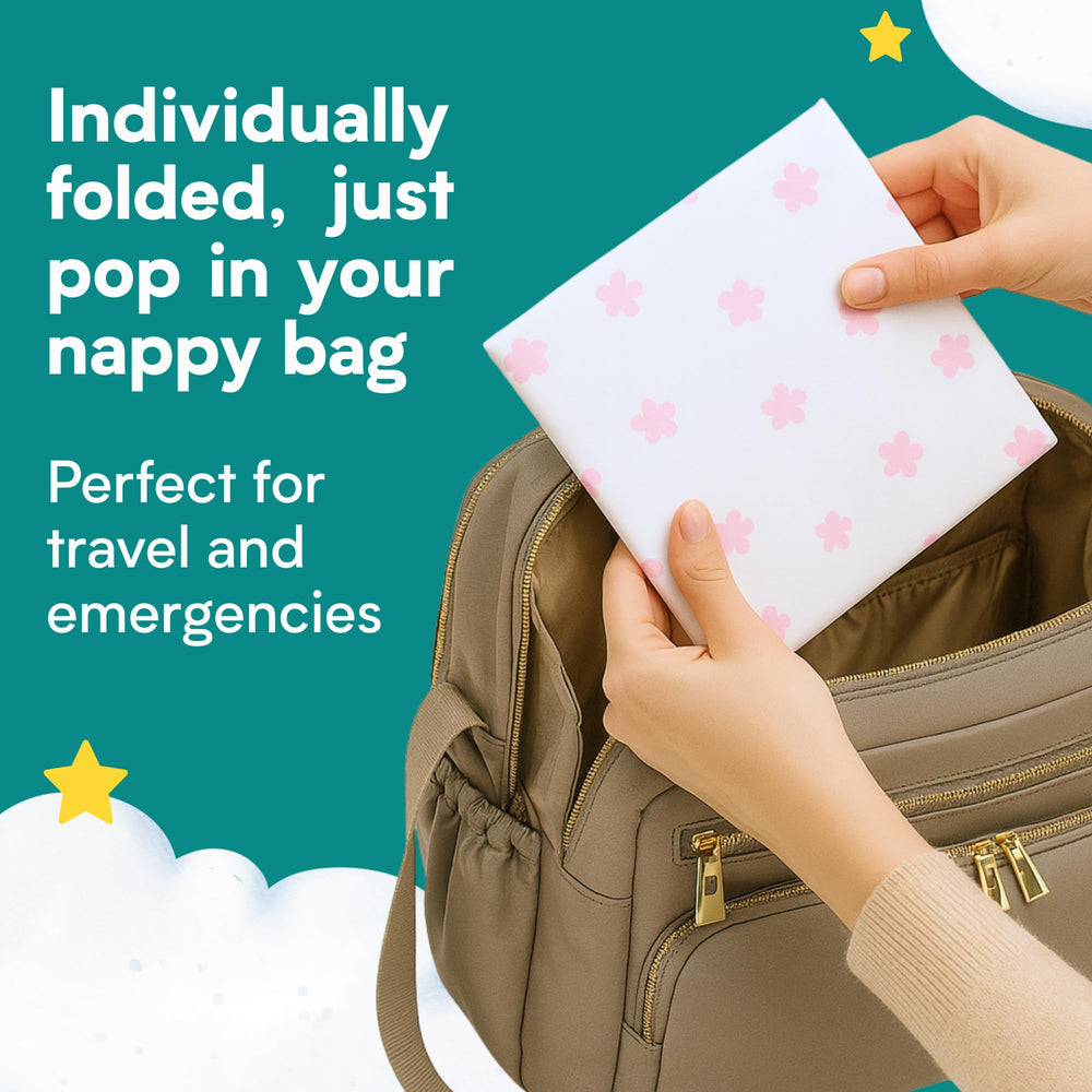 Eli with Love floral pad neatly tucked in a diaper bag for travel