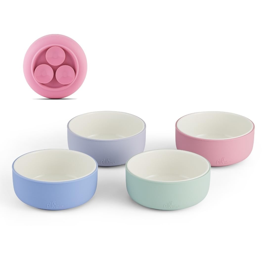 Elk and Friends kids porcelain bowls with suction sleeve on table for mess-free meals.