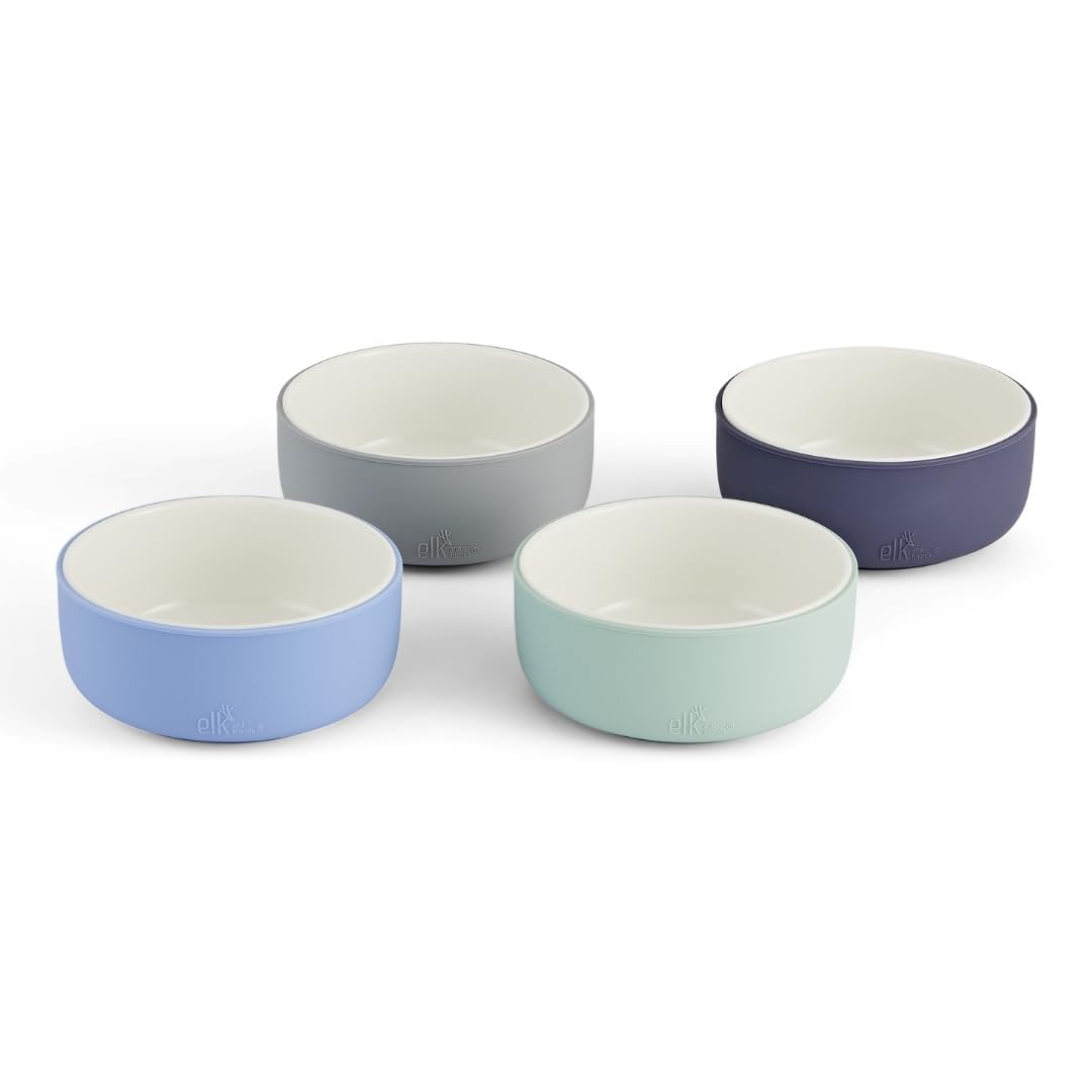 Elk and Friends kids porcelain bowls with silicone sleeve shown on table for non-slip grip.