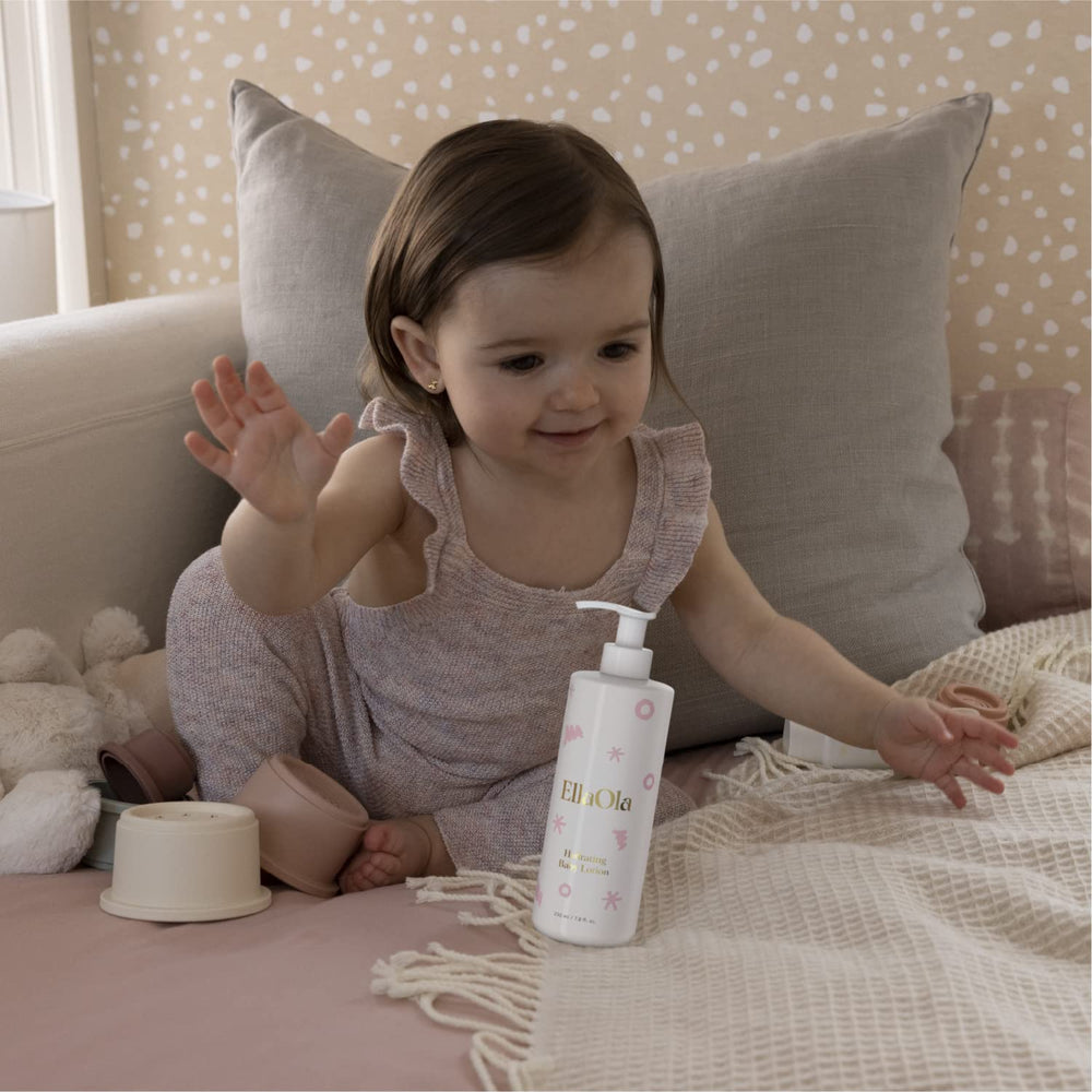 Soft baby skin after routine with EllaOLA moisturizing lotion.