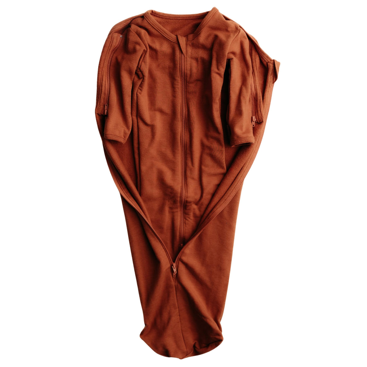 Elovee & Co. rust swaddle fabric close-up, silky and breathable against baby skin