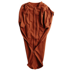 Elovee & Co. rust swaddle fabric close-up, silky and breathable against baby skin