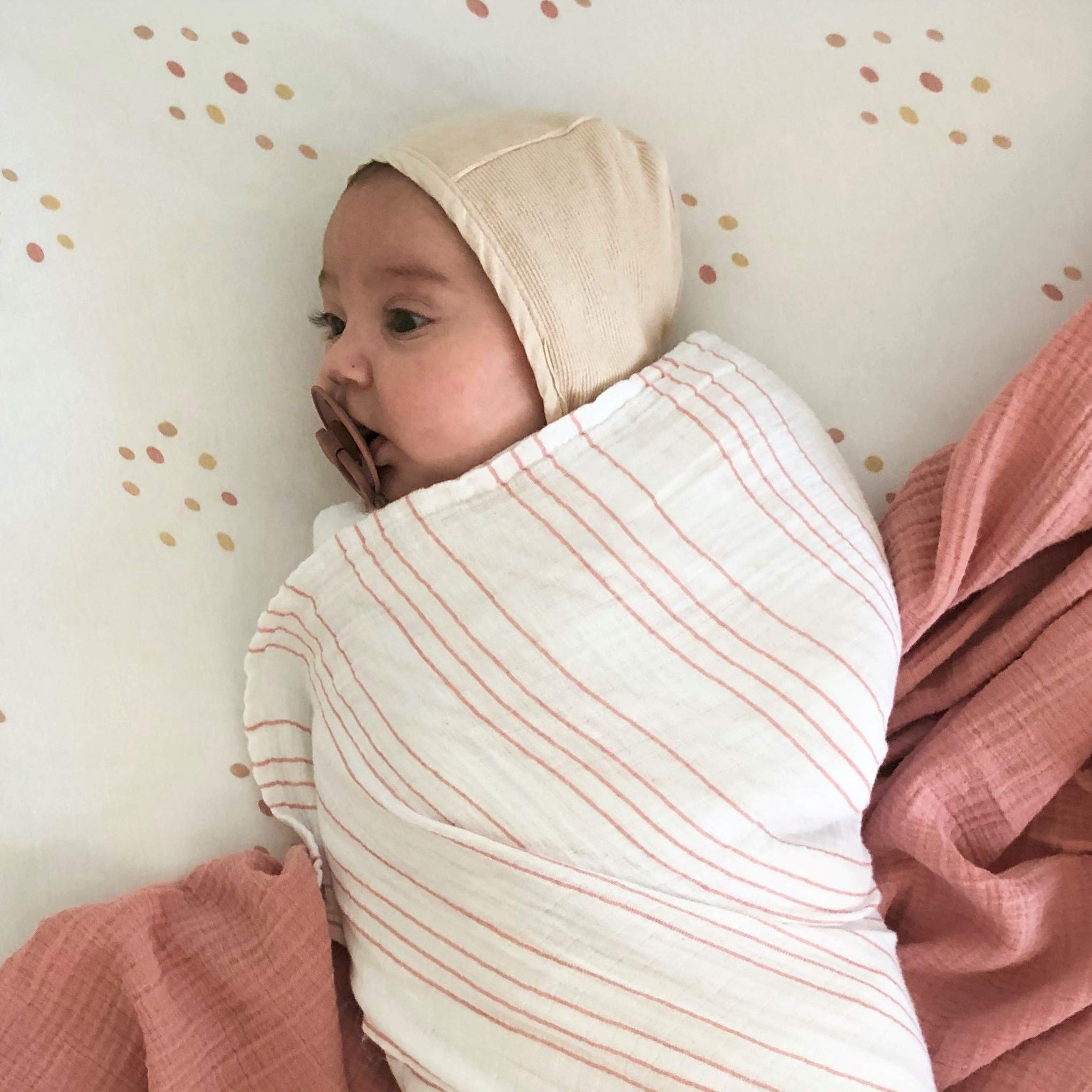 Ely's & Co muslin swaddle used as nursing cover for convenient feeding.