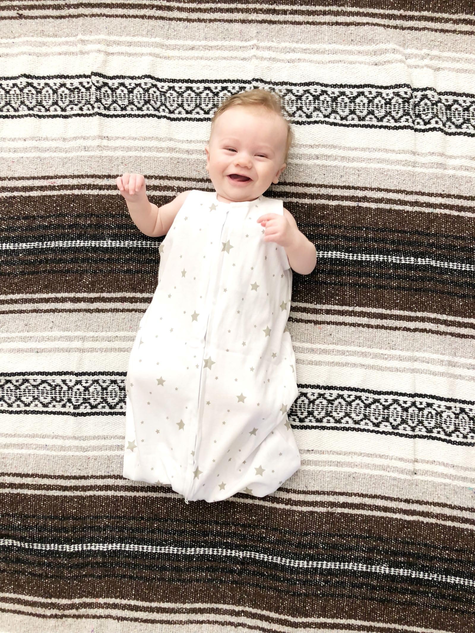 Ely's Co. Sleep Sack worn by baby at night for comfort.
